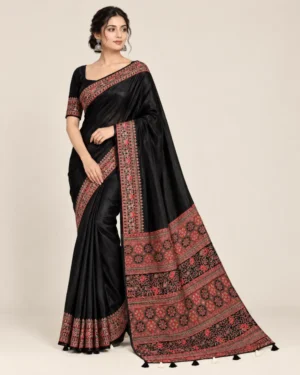 Maroon Ajrakh creap silk saree with printed borders and matching blouse piece.