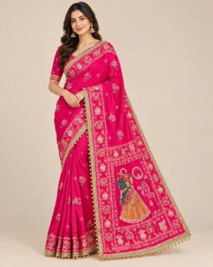 Red festive saree with mirror work, decorative border, and traditional Karwachauth-style motifs.