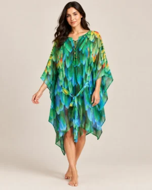 Flowing multicolour printed kaftan with tie-front neckline and wide sleeves hanging on a hanger.