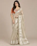 Cream satin saree with silver border and orange stitched Aangi blouse